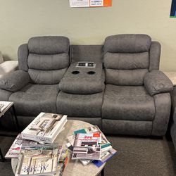New gray two-piece reclining sofa and loveseat with free delivery