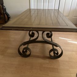 Wood coffee table with rod iron paisley legs