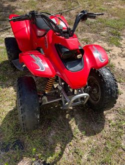 This is a red Kasea Skyhawk 90 ATV