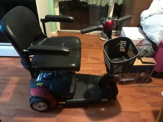 Burgundy and black mobility scooter