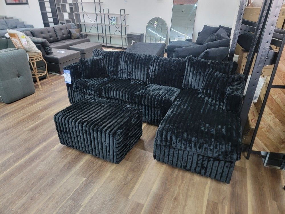 Brand New Sectional And Ottoman In Black Corduroy