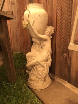Yard art Approx 28” tall Holds a small 3” pot