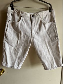White G-Star denim shorts with a clean, modern cut. Five-pocket styling with reinforced stitching. Button and zip front closure. Versatile pairing for