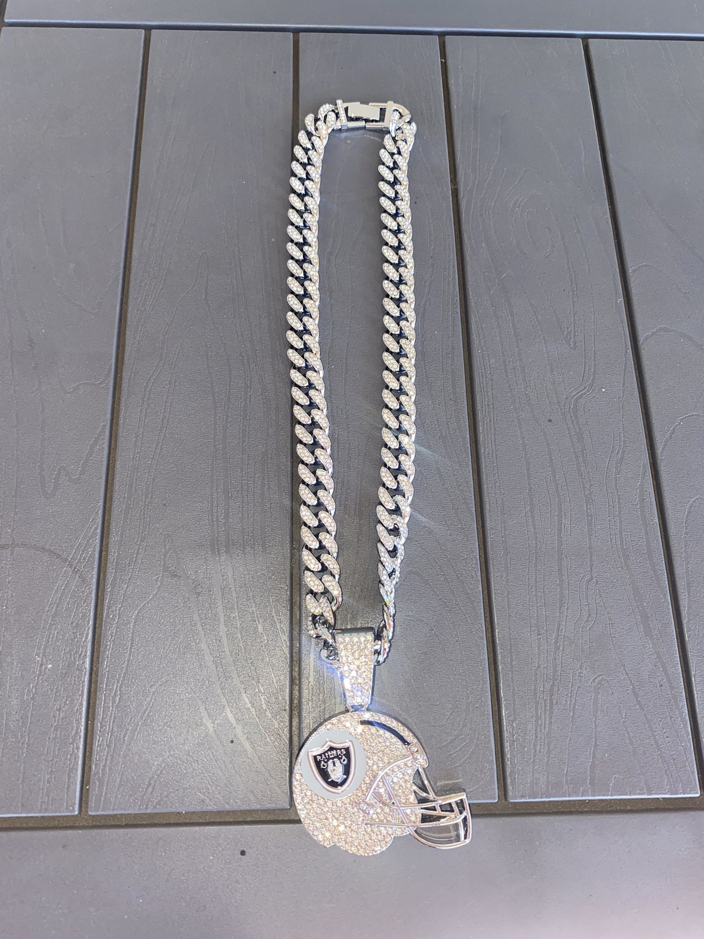 Brand New Blinging  Raiders Helmet pendant and Chain $60