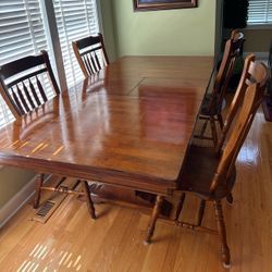 Wood Table, 4 Chairs, 1 Bench , Built in extension Leaf