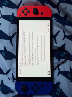 Nintendo Switch with Red and Blue Joy-Cons (7 games included)