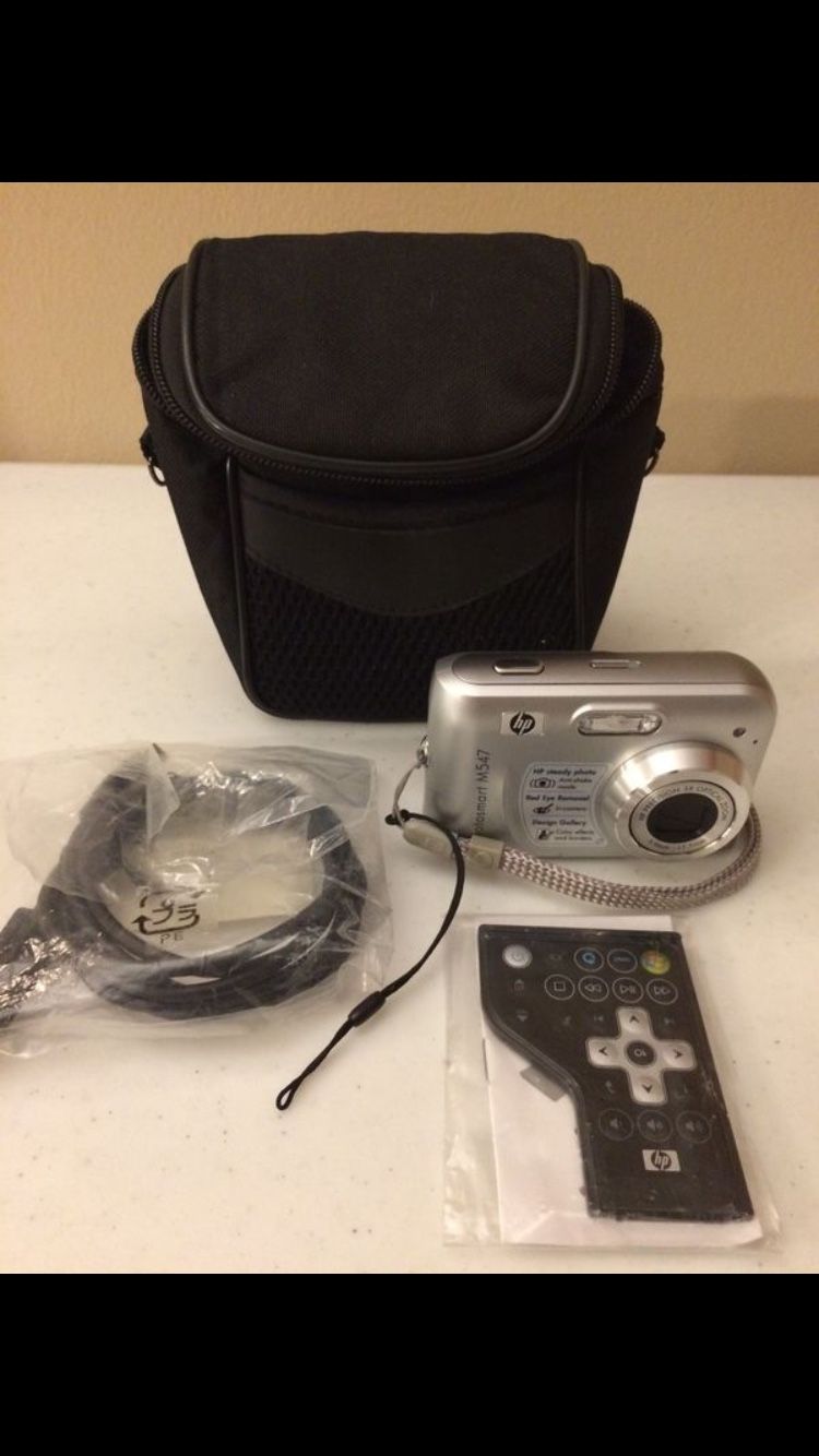 Photosmart HP M547 digital photography camera with extras NEW Pick up Address: 5485 W Sahara Ave, zip 89102