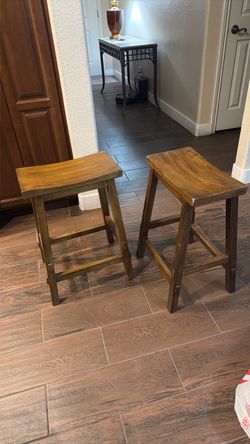 2 brown wood bar stools 24 inch high