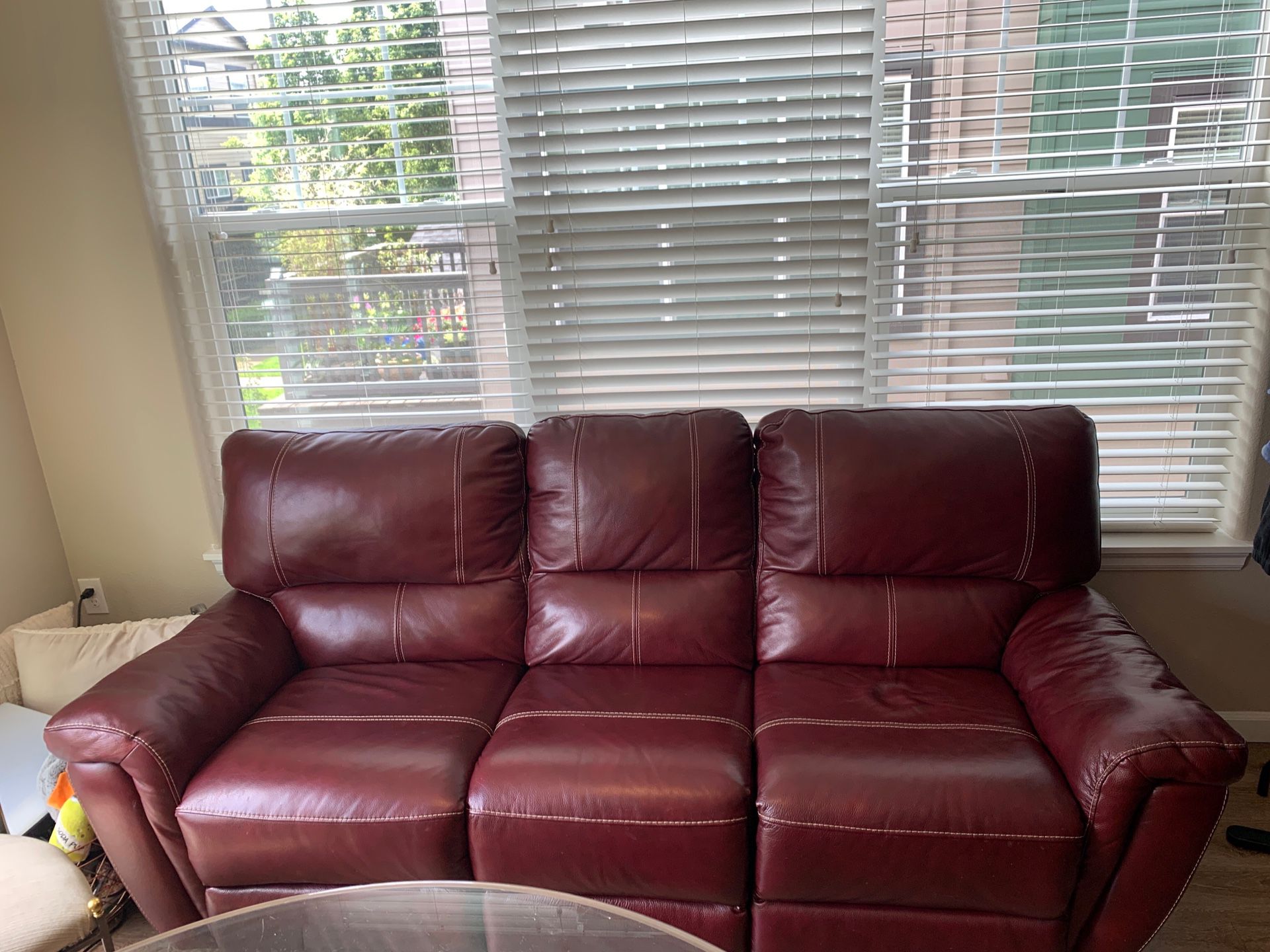 Ashley leather couch (like new) with Manual duel end recline. Must pick up and load.