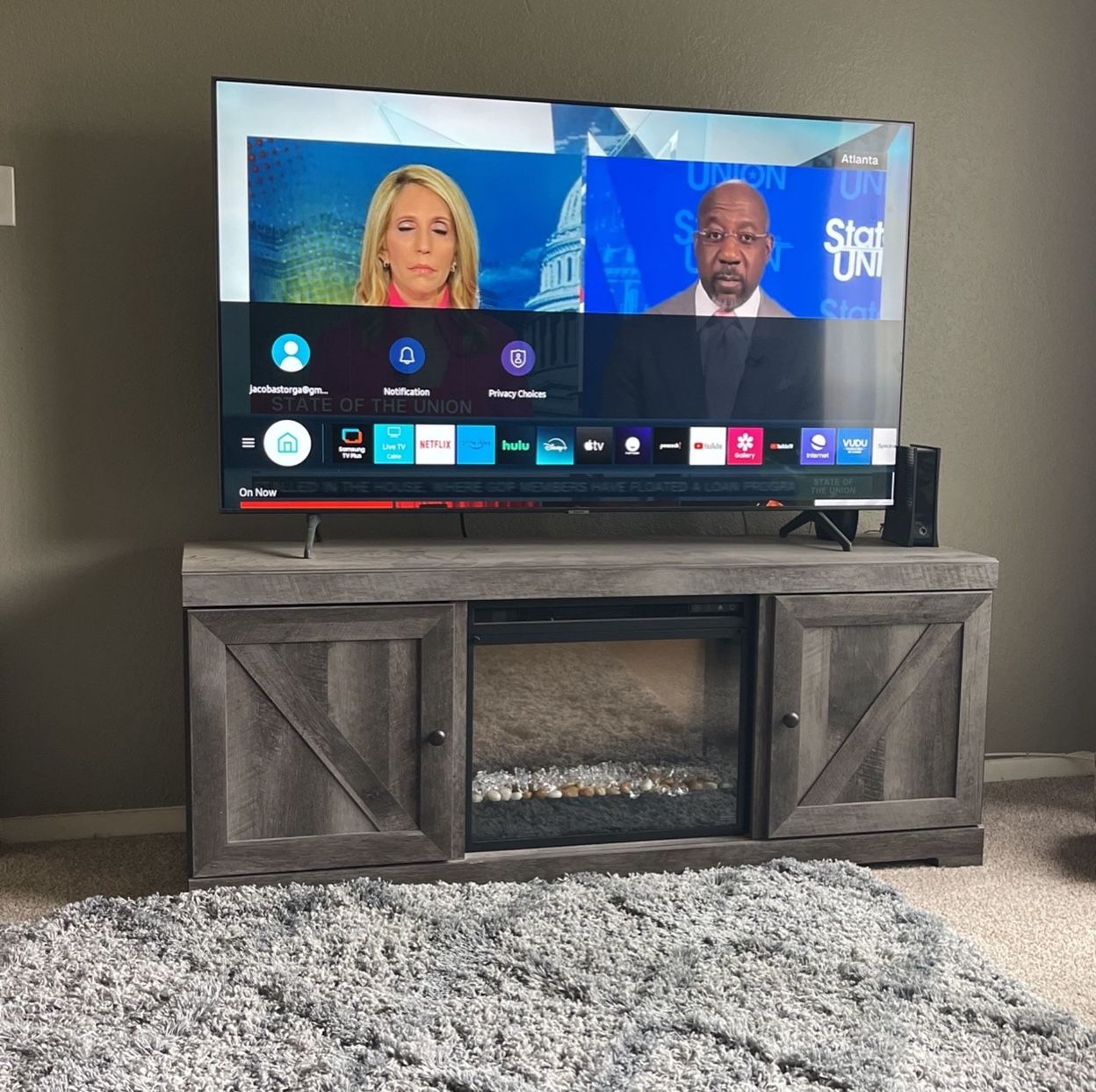 65” Smart Samsung Tv With Fire Place Stand 