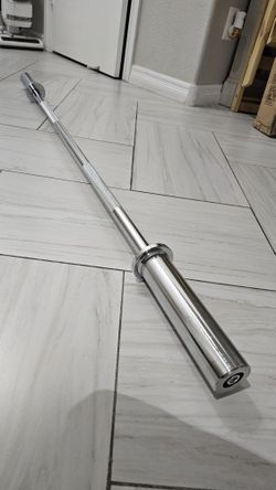 New 57inch- 16.5lbs Barbell. Holds 2inch Olympic Weight Plates. 