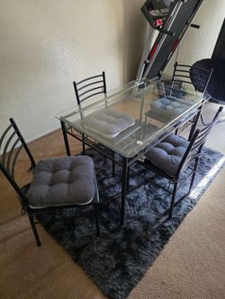 Glass Dining Table with 4 Chairs and 4 Gray Chair Pads