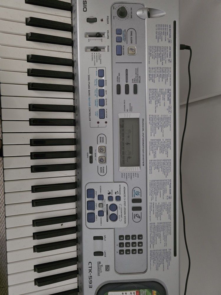Casio CTK 595 Keyboard And Stand.
