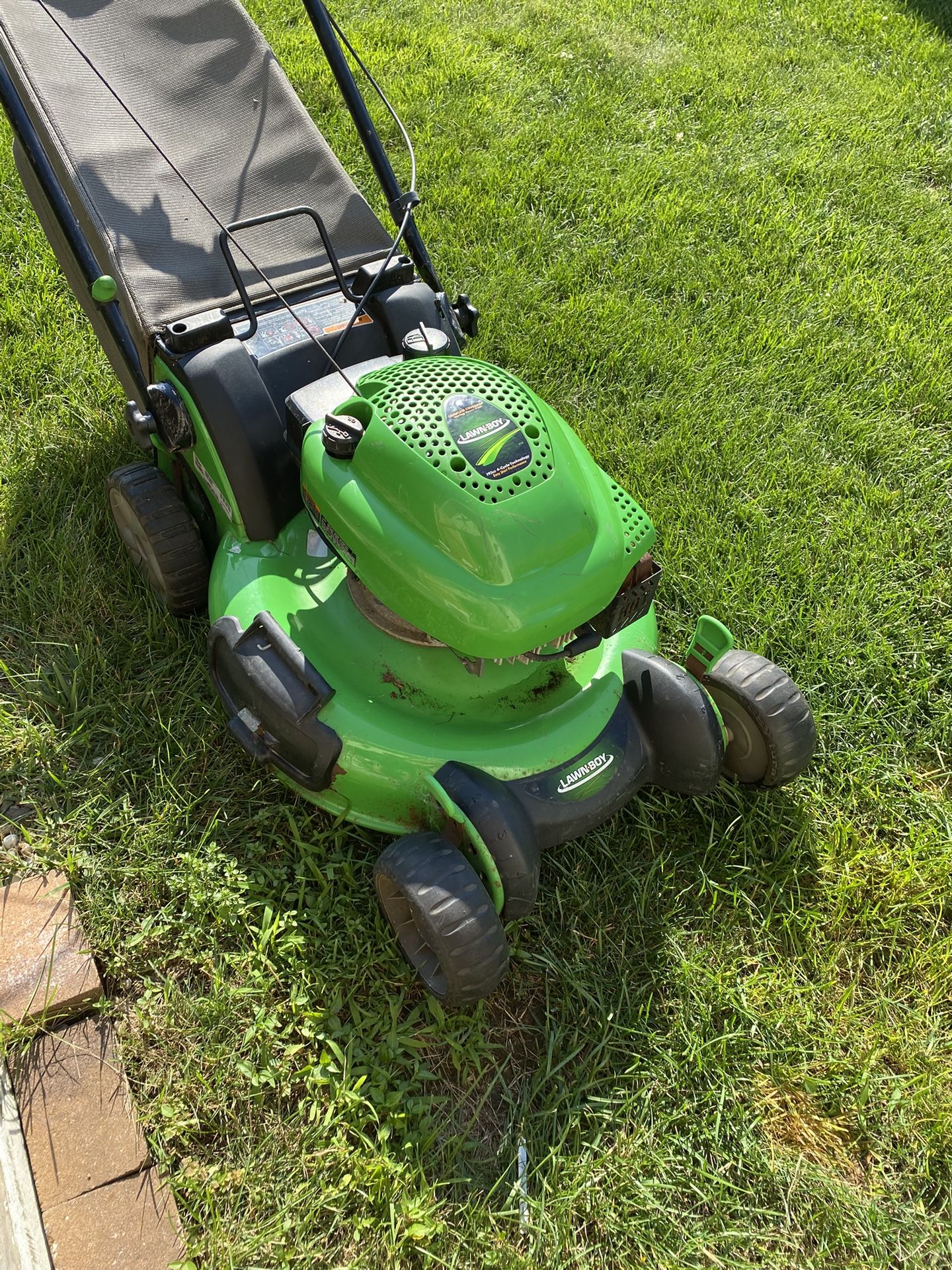 Lawn boy push mower runs good new carb. It’ll get the job done.