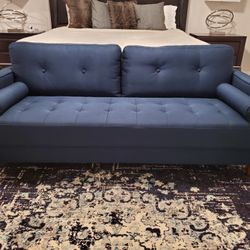 Like New- 76" Mid-Century Modern Tufted Navy Blue Sofa with 2 Bolster Pillows and Tan Legs