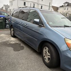 Blue color Honda three row of seats