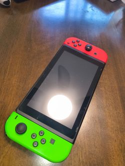 Nintendo Switch with Neon Red and Green Joy-Cons