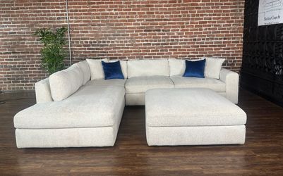 Delivery Available Costco ivory 2pc sectional couch w ottoman retails 1300