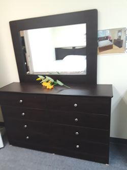 Dark brown dresser with mirror