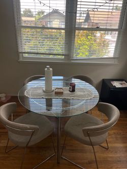 Round glass table with 4 chairs