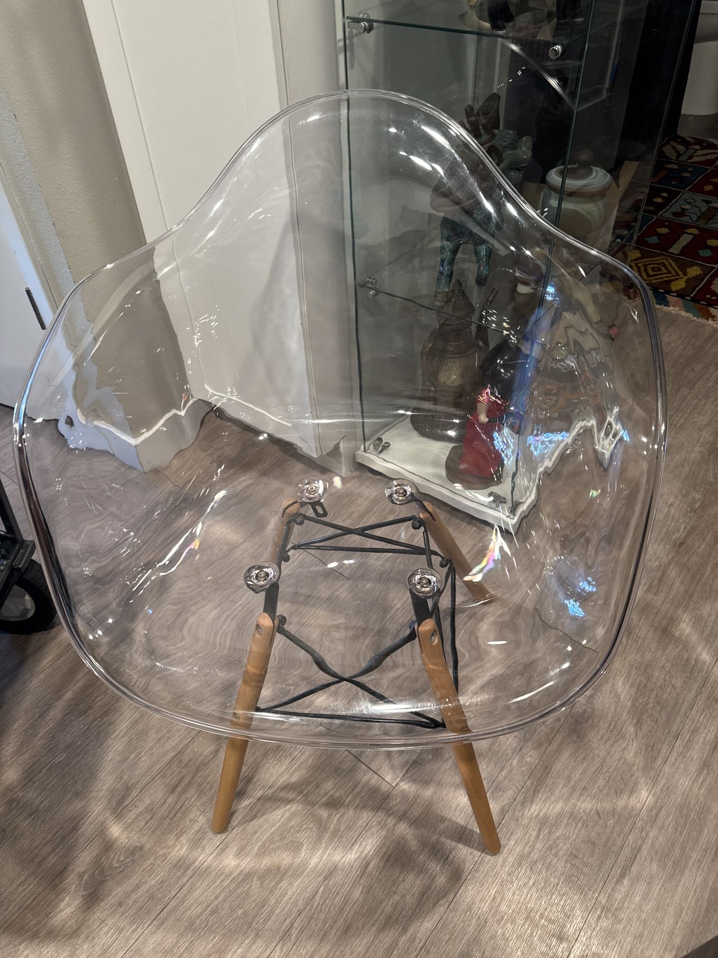 Comfortable plexiglass chair with arms, wood legs