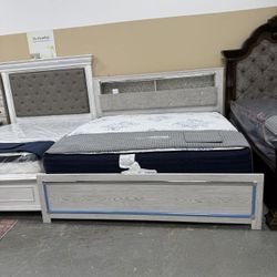 Altyra White Upholstered Bookcase LED Queen Panel Bed