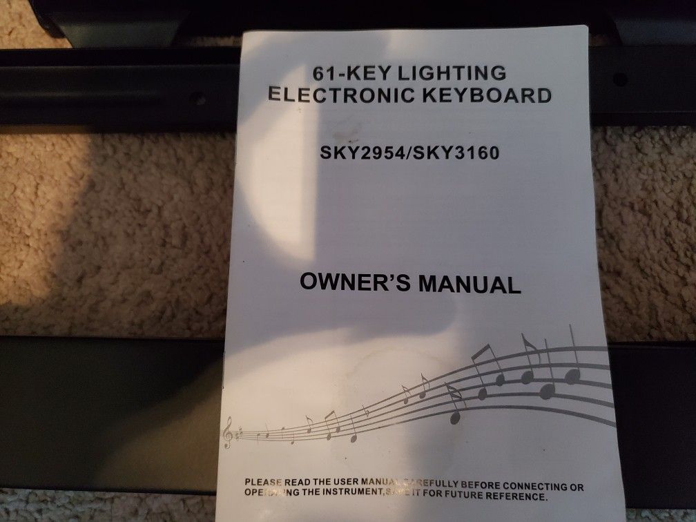 61 key lightup keyboard with stand and stool.