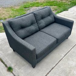 Handsome charcoal loveseat