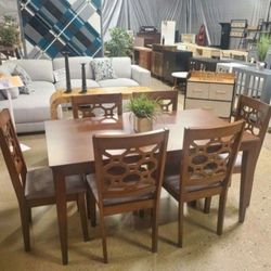 7-piece dining set imparts a rustic tone in any dining space. Highlighted by a sturdy rectangular table with straight lines, it includes 6 side chairs