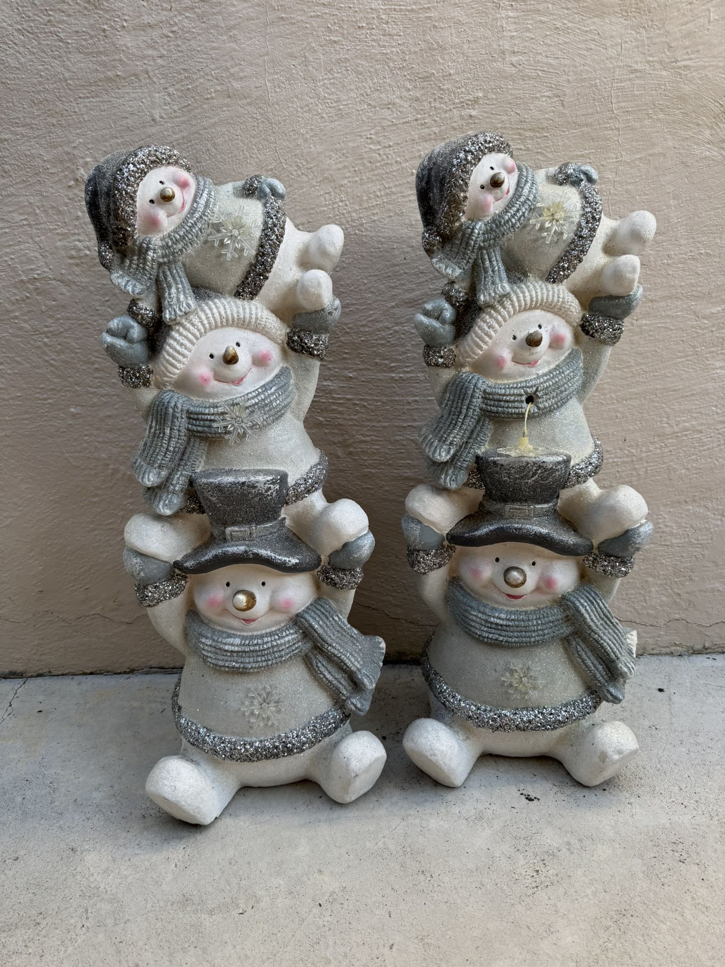 Set of two Festive Snowman Figurines with Gray and white Accents stacked in a playful design. Perfect for Christmas holiday decorations. Size: 71cm H 