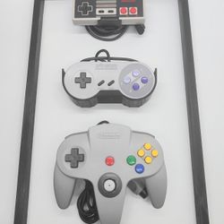 Nintendo OEM NES SNES N64 Controllers mounted on 11x17 Frame
