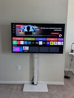 LG 55 inch Smart tv and white TV Stand with Power Outlet