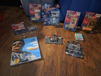 Dale Earnhardt Nascar's collection set 6 medium size car's one figurine  one book one small pitcrew and a pack of playing cards still in the plastic n