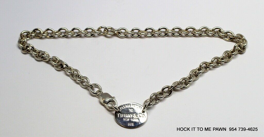 Please Return To Tiffany & Co Silver Oval Tag Love Charm Necklace 100% Authentic.