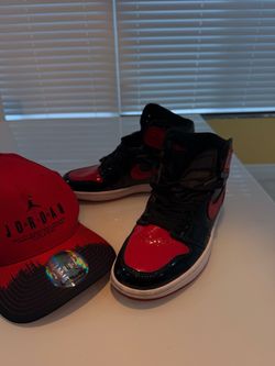 Jordan 1 red/black sneakers with red/black color blocking and a red Nike swoosh #basketball #retro