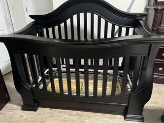 Espresso wood crib. Convert into a  bed.  Crib and rail only.