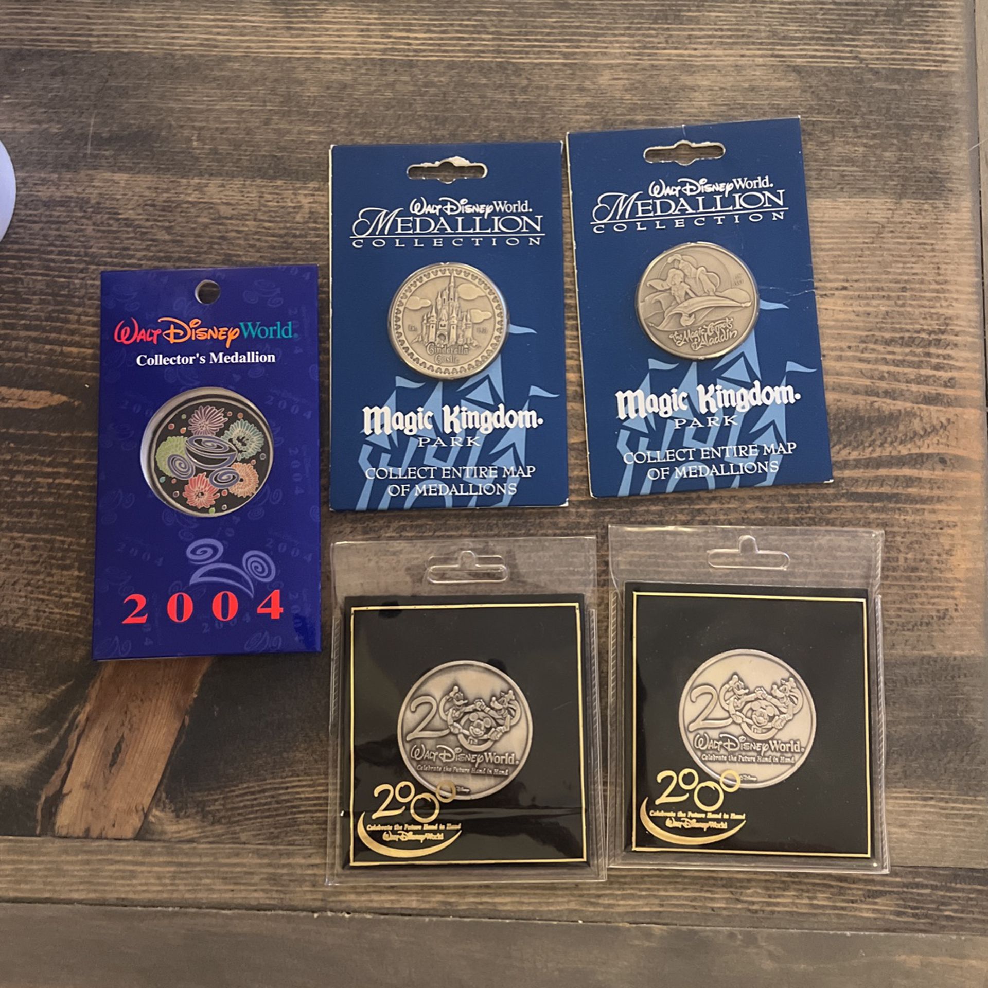 5 Walt Disney World Collector’s Medallions