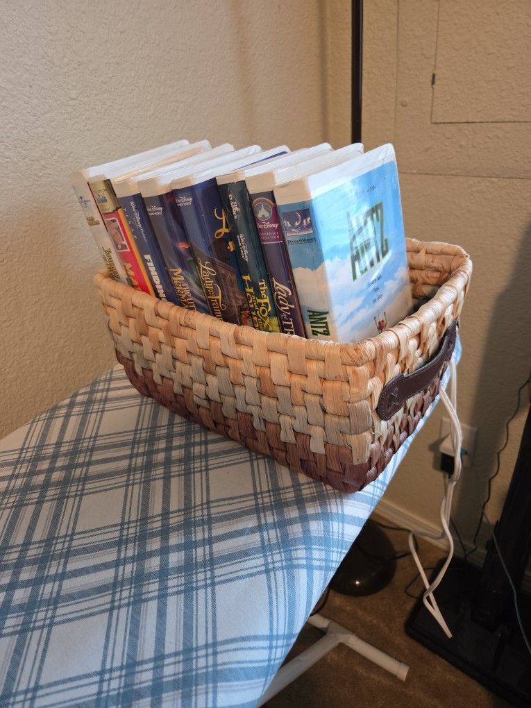 ASSORTED DISNEY VIDEOS IN BASKET