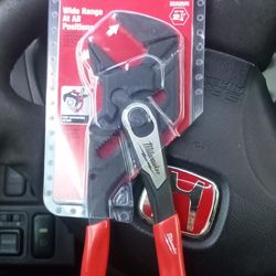 Milwaukee 10-inch pliers wrench (model 48-22-0010) featuring a push-button adjustment and red ergonomic handles