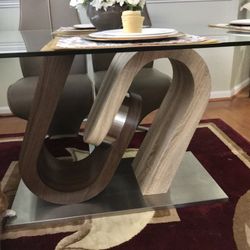 Dining Table set with Six Chairs, Glass top. In Great Condition, but two chairs are slightly damaged by cat.