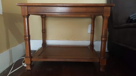 Wooden side table with glass top