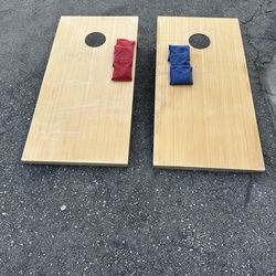 Used wooden cornhole set
