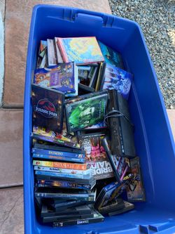 DVD player and bin full of DVD’s