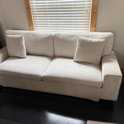 Gently used beige couch
