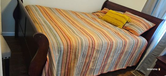 Dark wood sleigh bed