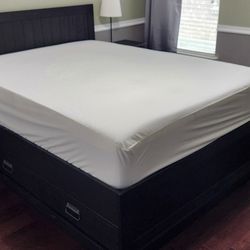 VERY comfortable queen mattress with wood bed frame.