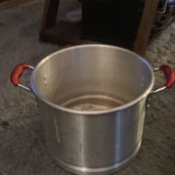 Silver pot with red handles rubber