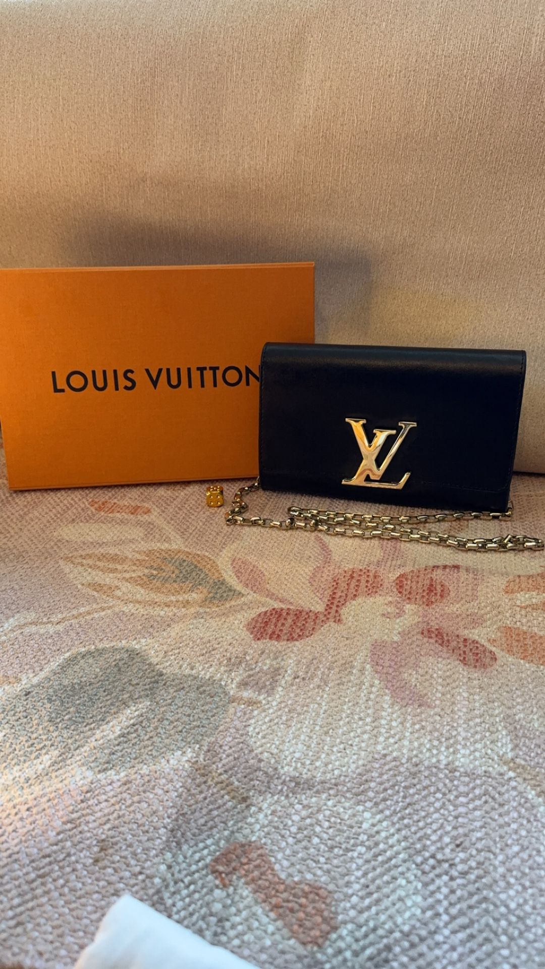 Louis Vuitton clutch with chain shoulder strap