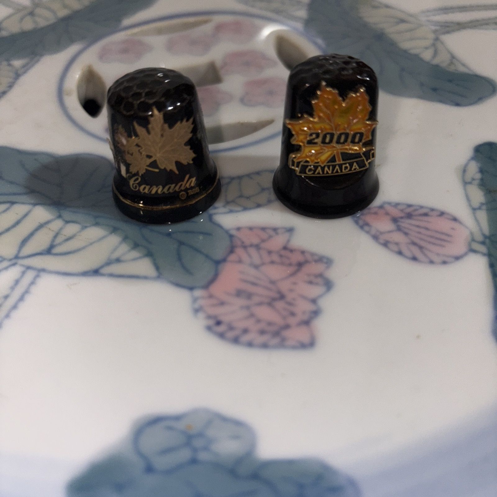 Pair Of Porcelain Black Canadian Thimbles