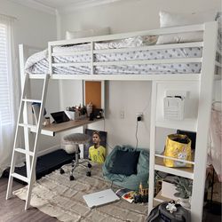 Twin bed with desk and shelving